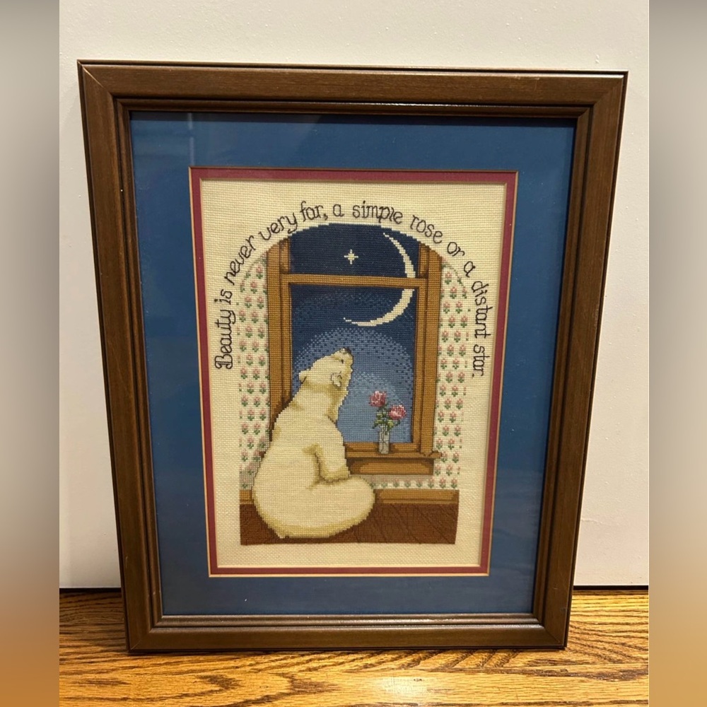 Framed, finished cross-stitch piece